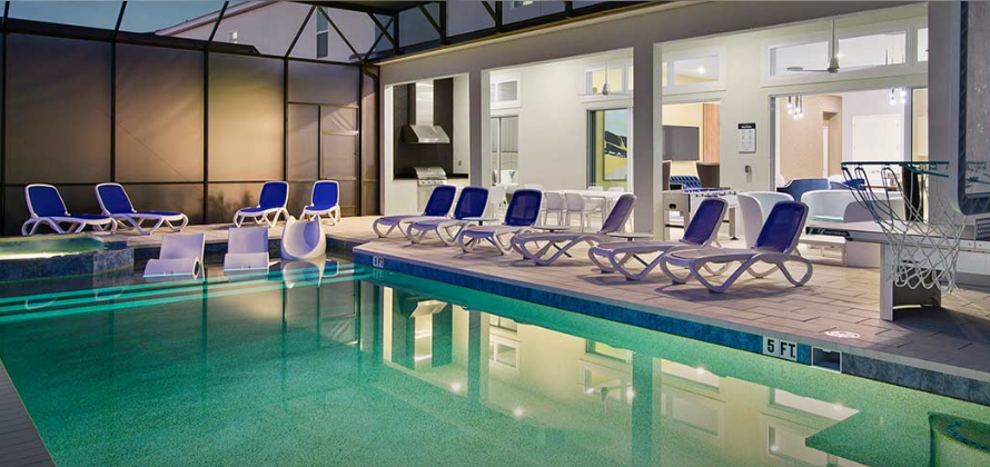 Screened pool deck with lounge chairs at the Orlando accommodations